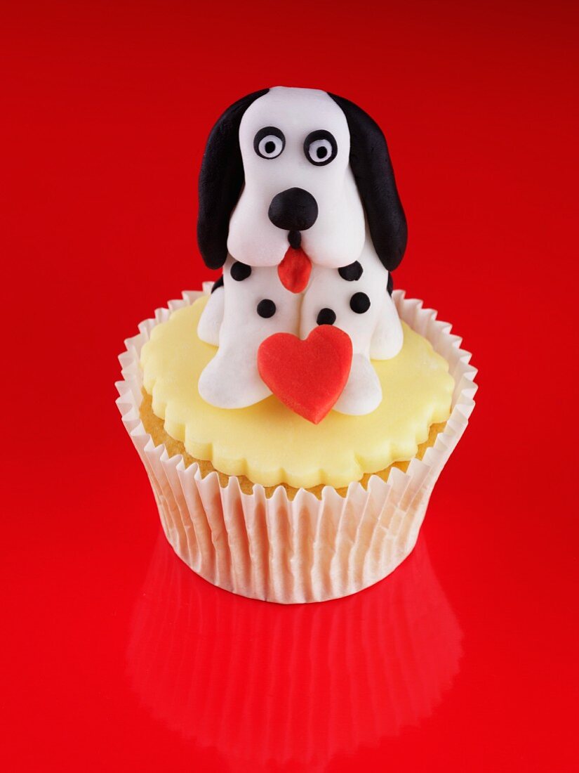 A cupcake topped with a dog for Valentine's Day