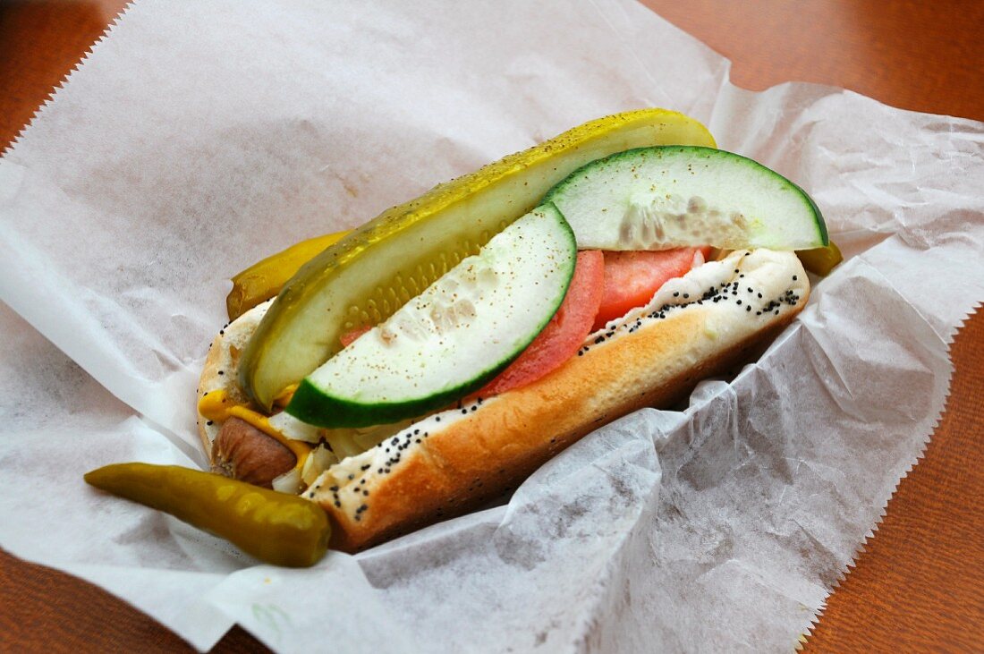 Chicago-style hot dog in paper