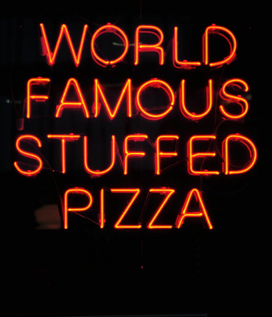 A neon sign on a pizzeria in Chicago
