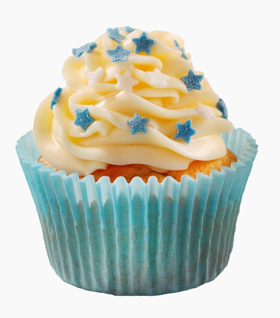 A cupcake decorated with buttercream and little stars