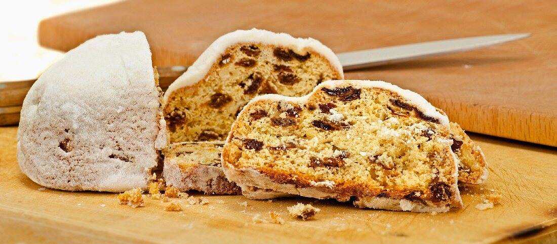 Stollen, sliced, on a chopping board