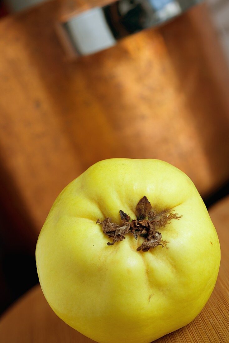 Quince in front of a copper pan