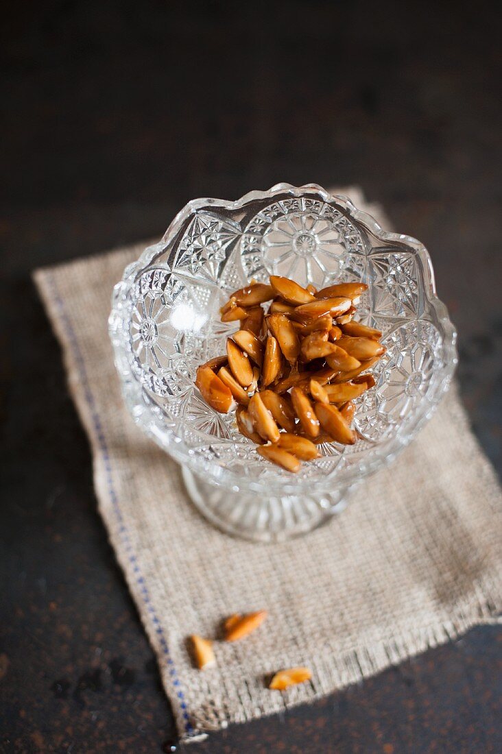 Roasted almonds in a crystal dish