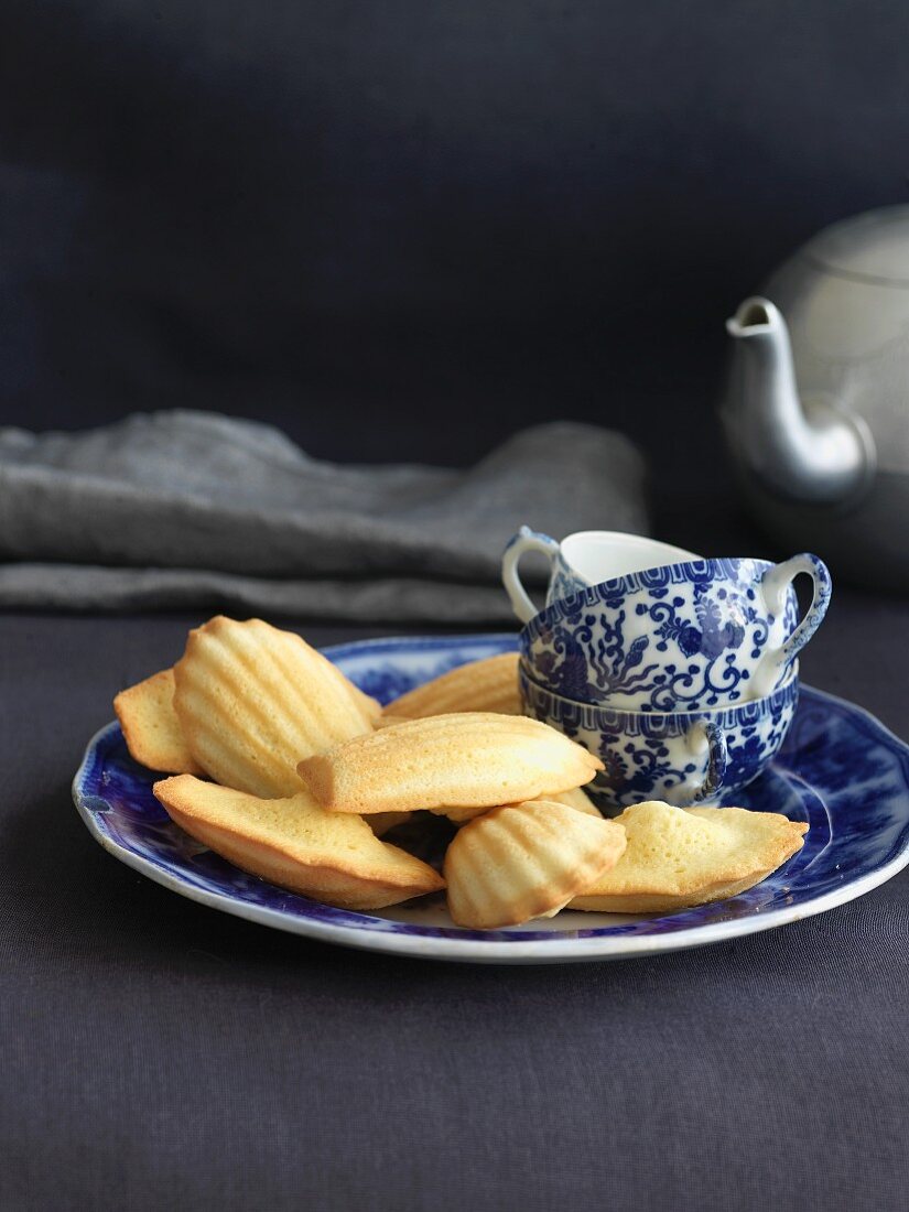 Madeleines on a Plate with Tea Cups