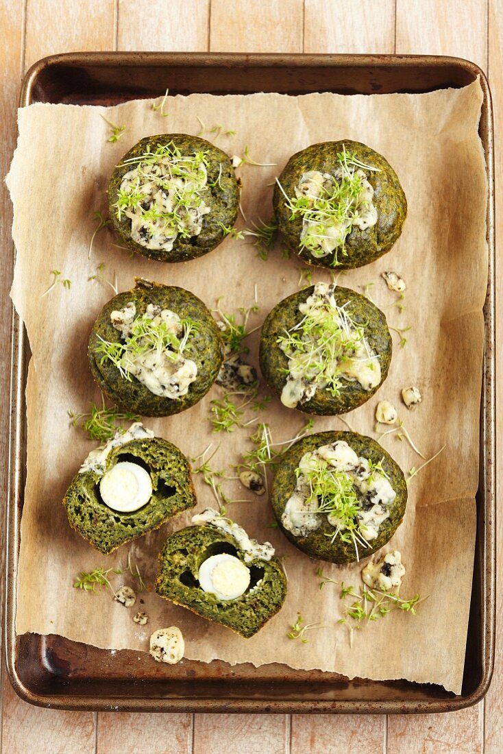 Spinach muffins with quail's egg and cress
