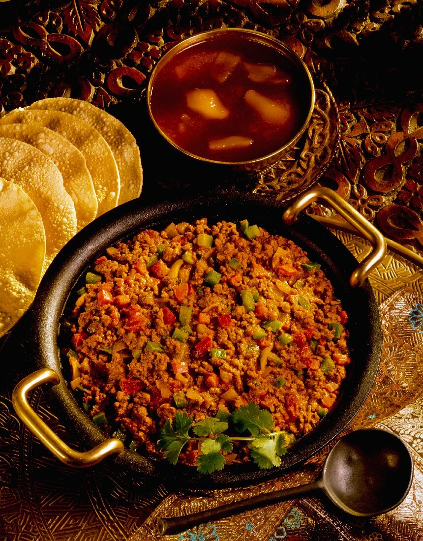 Lamb curry with mango chutney and poppadoms (India)