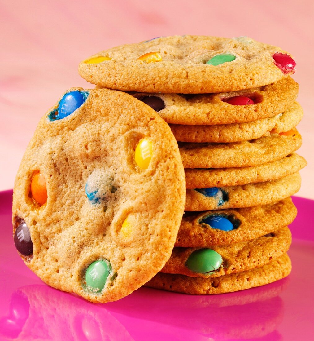 A stack of cookies with colourful chocolate beans