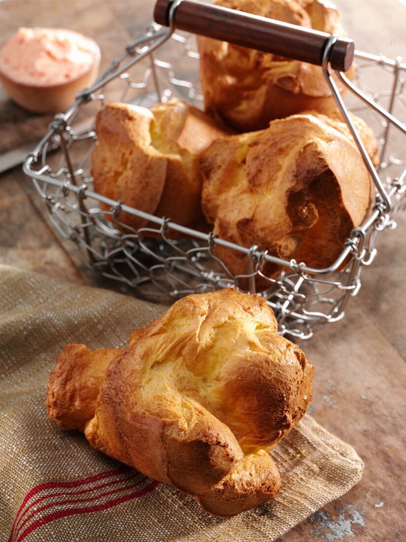Popover on a Dish Cloth with Popovers in a Wire Basket