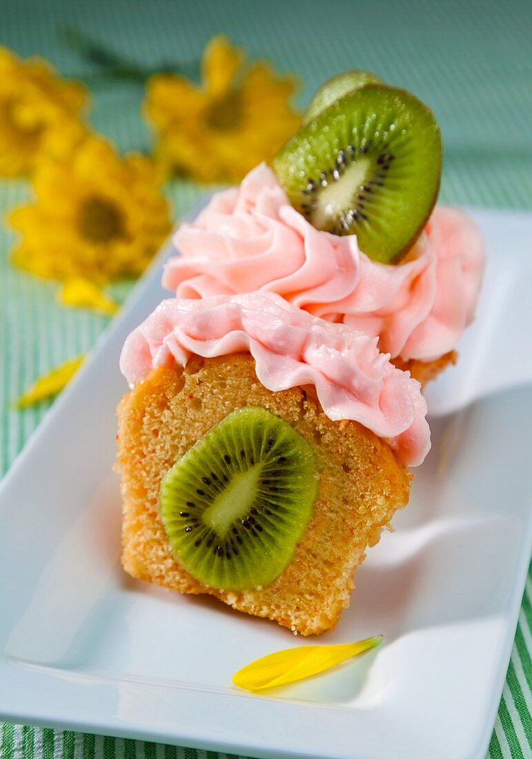 Kiwi Stuffed Cupcake with Strawberry Frosting