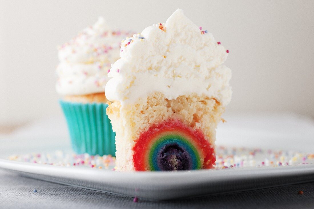 A cupcake with rainbow filling