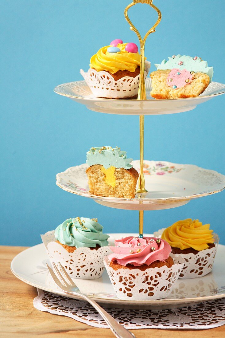 Various cupcakes on a cake stand