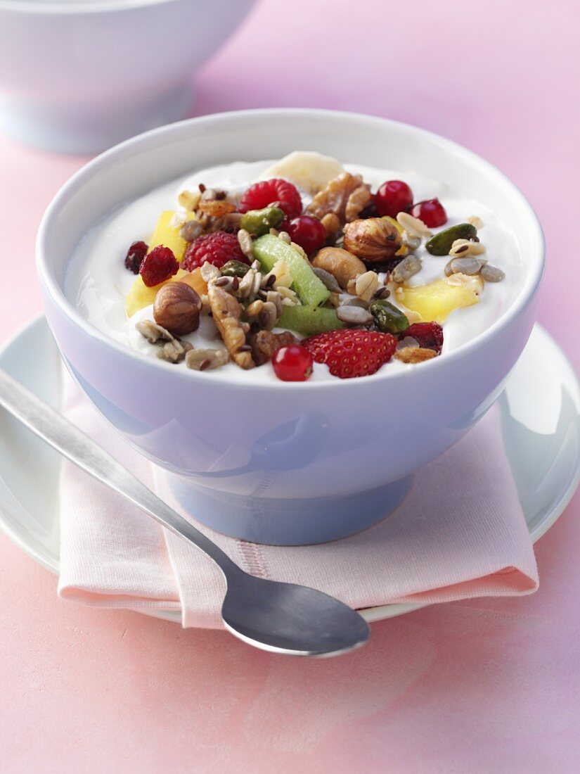 Yoghurt and muesli with nuts, seeds and fresh fruit