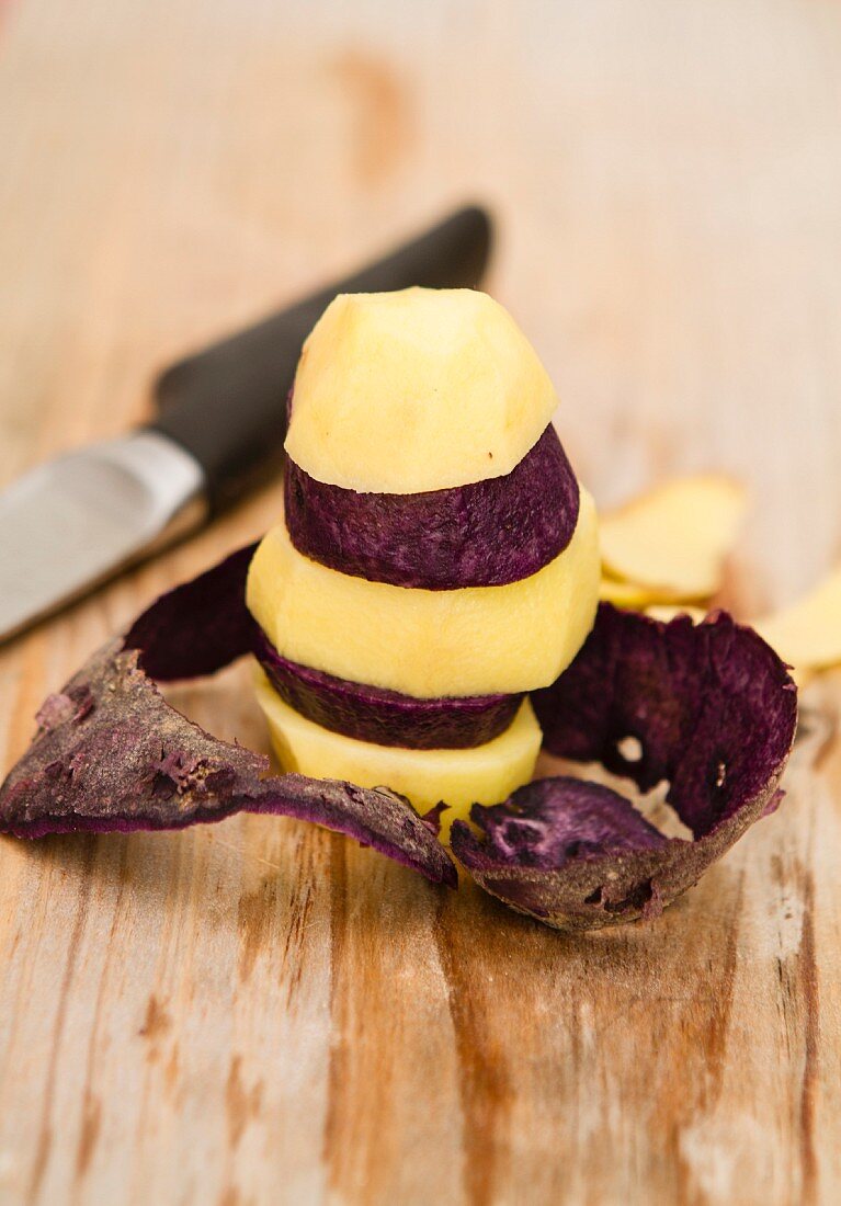 Yellow purple potato slices, stacked
