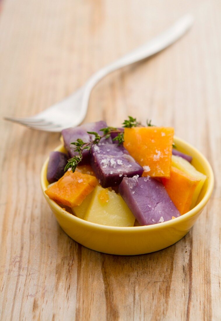 Steamed potatoes and sweet potatoes in a bowl