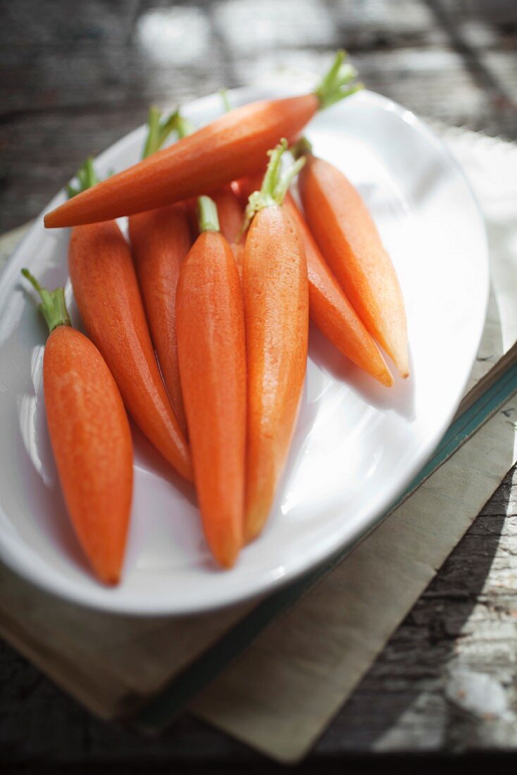 Peeled baby carrots on a plate
