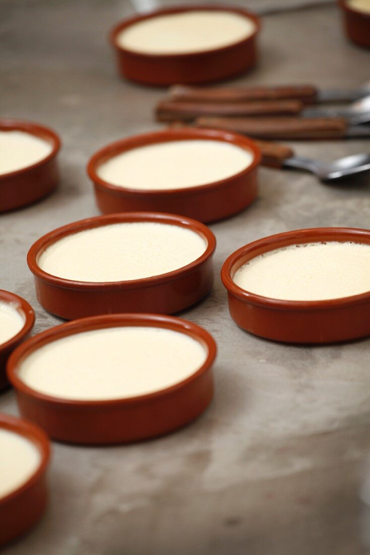 Crema catalana being prepared in individual dishes