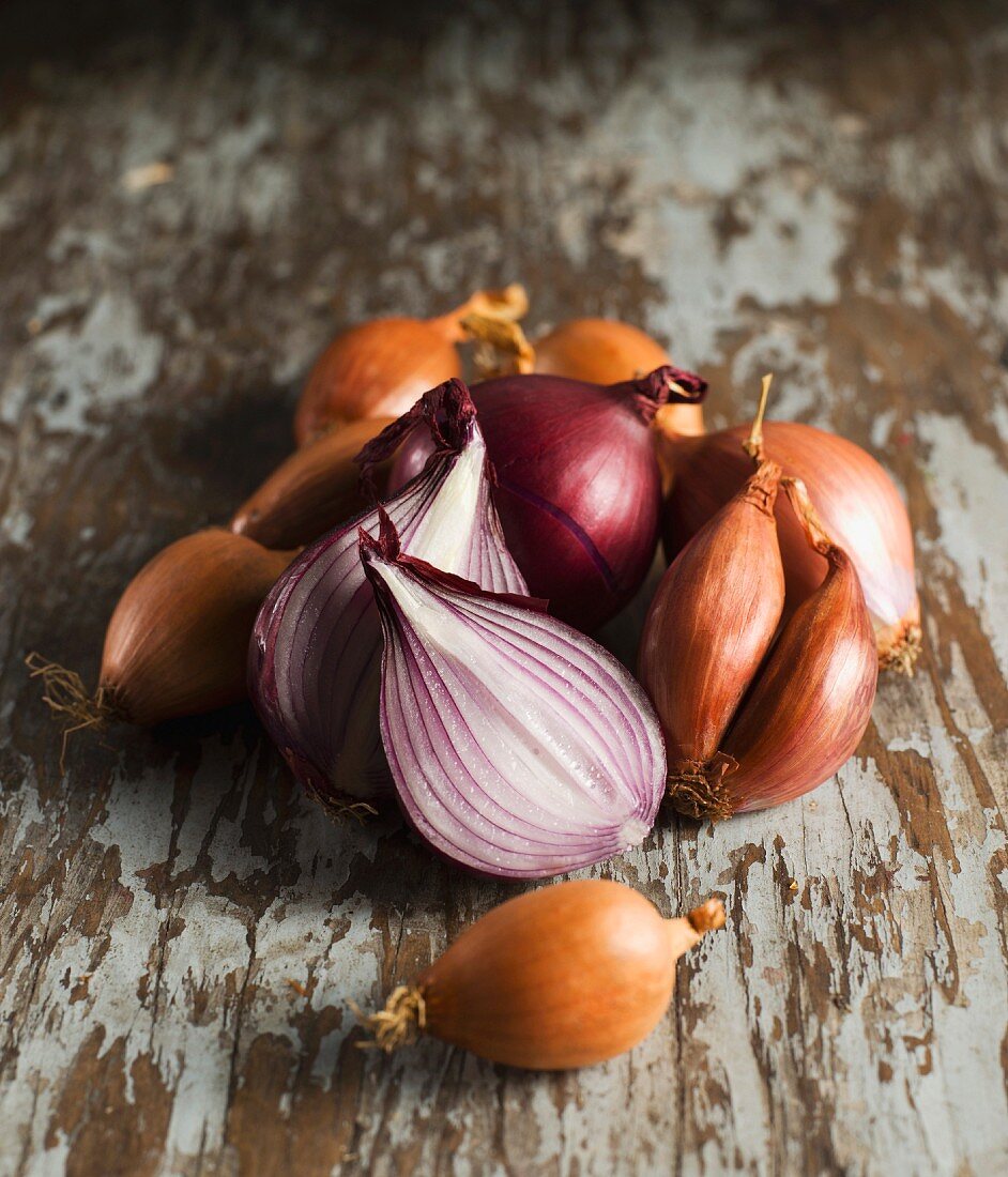Several shallots and red onions