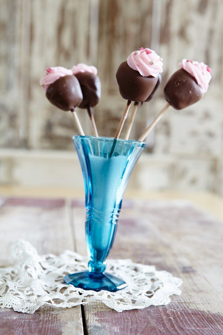 Chocolate lollies in a dessert glass