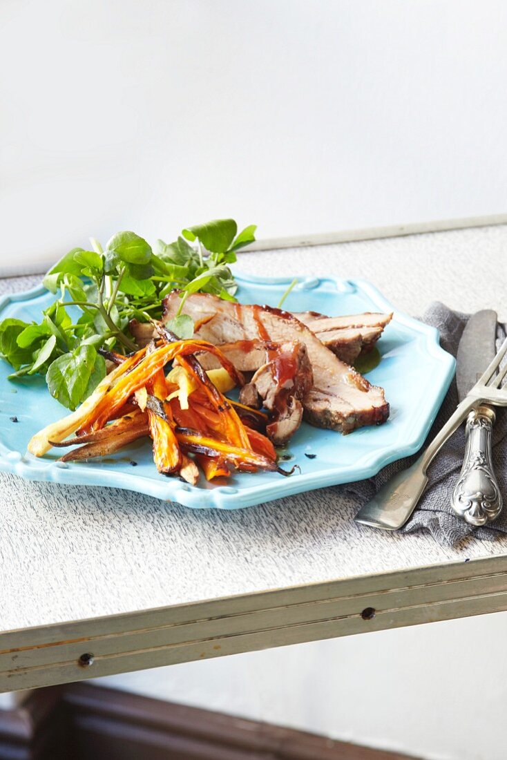 Pork belly with glazed carrots and parsnips