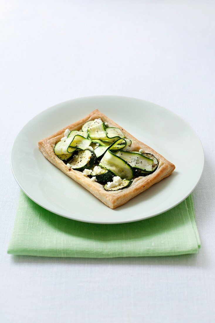 An individual feta and courgette tart