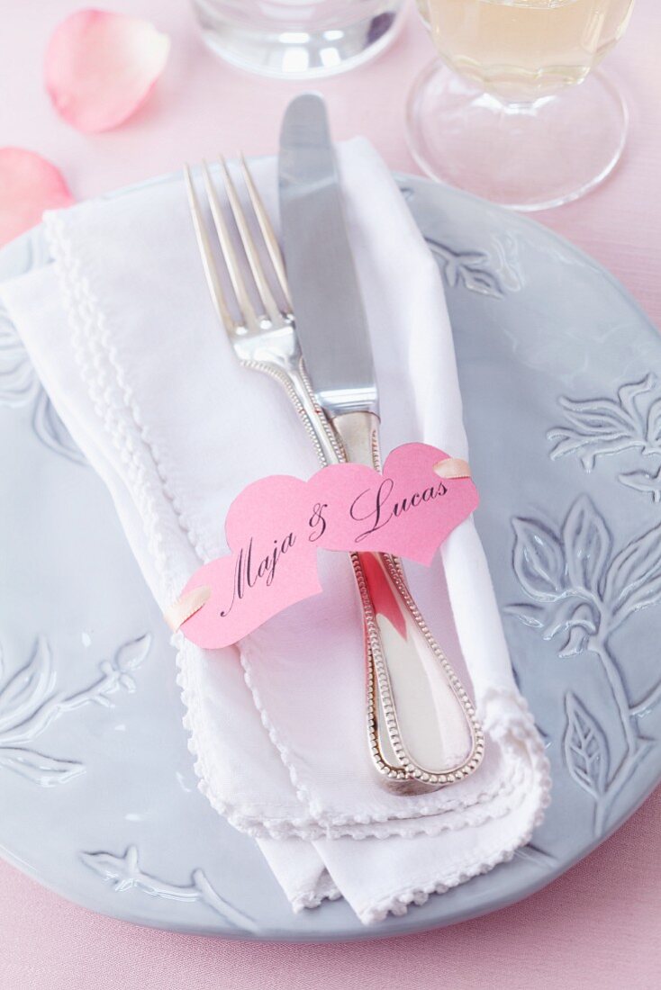 A place setting with napkin and place card