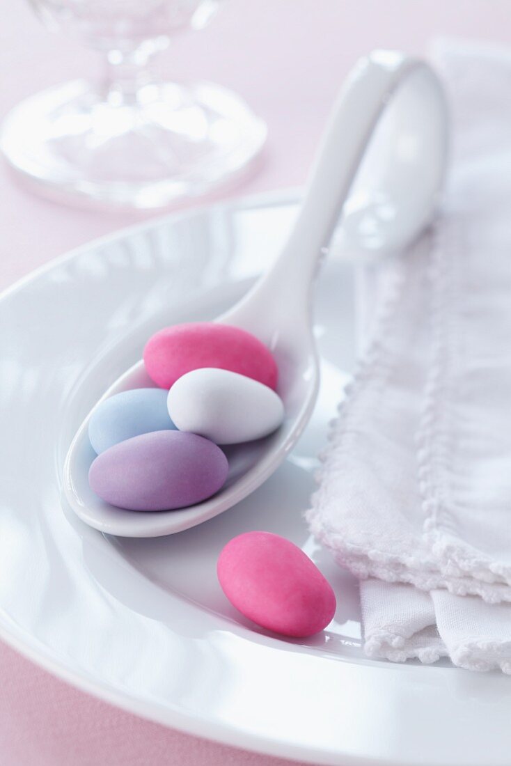 Sugared almonds on a spoon for a wedding