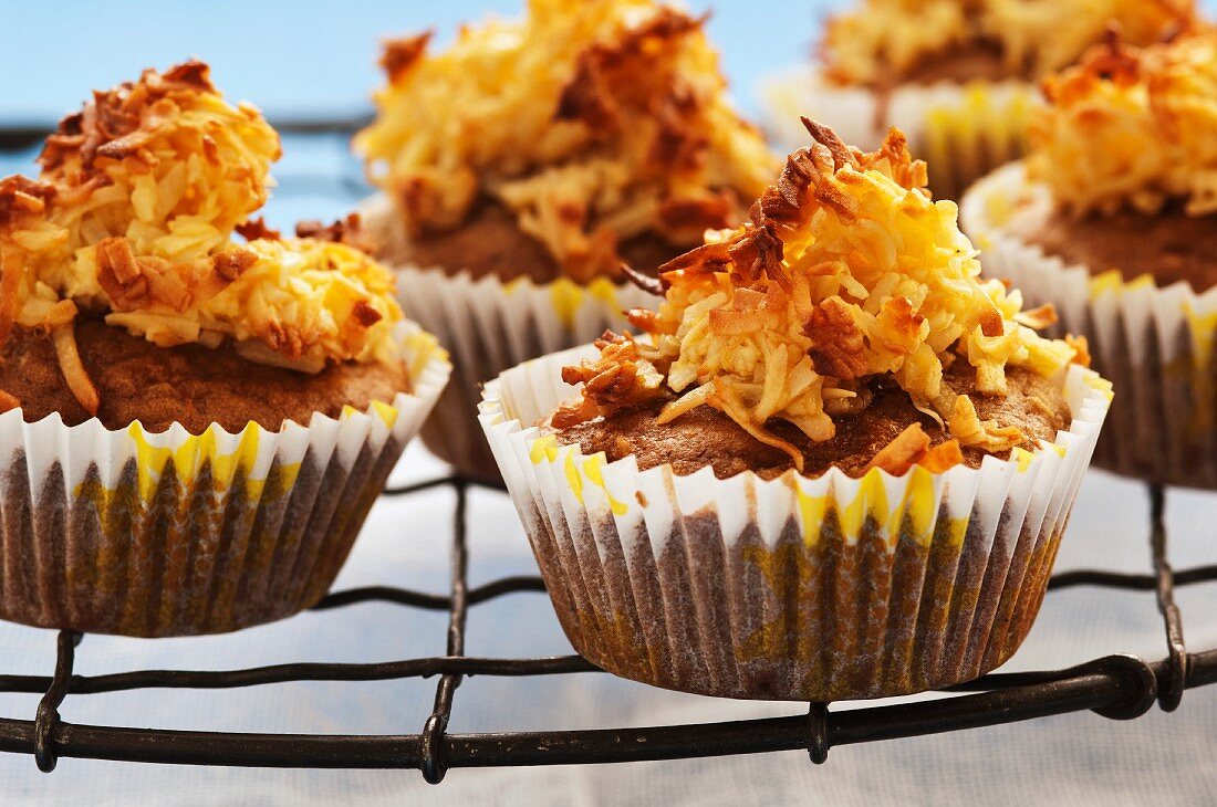 Muffins topped with nuts and coconut