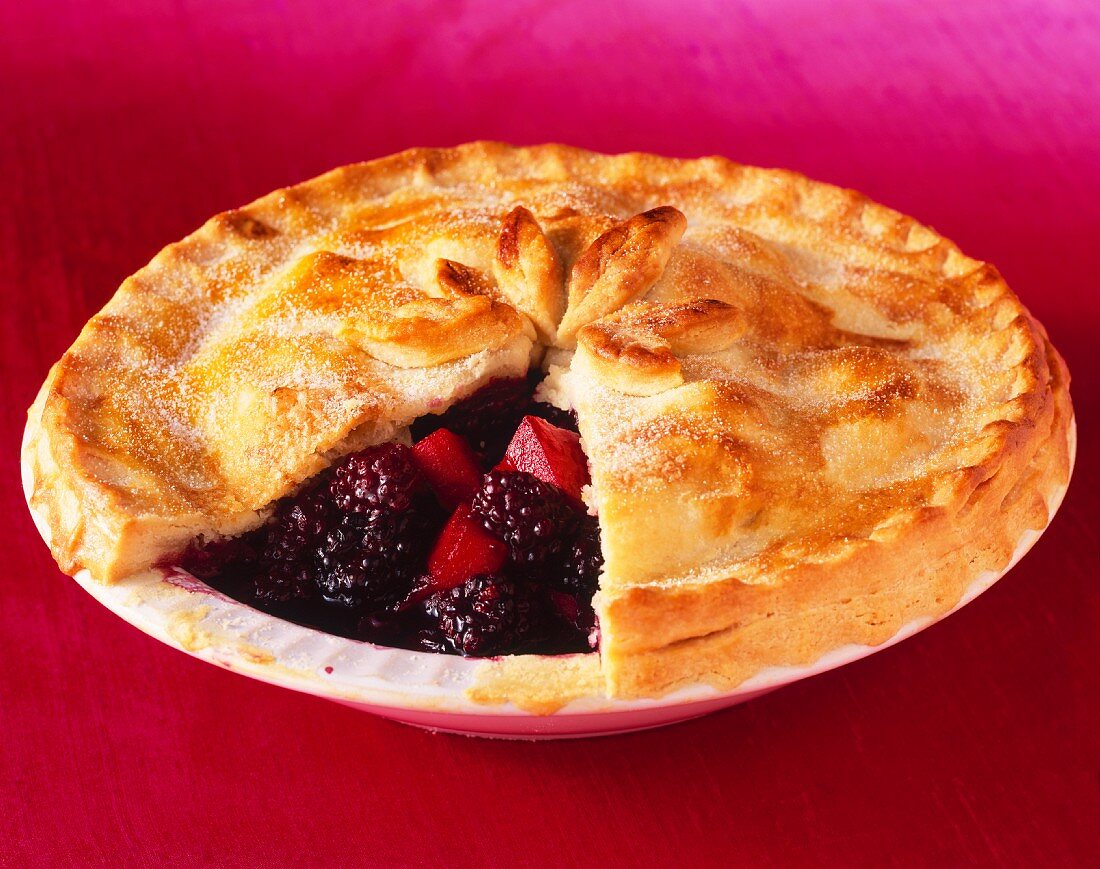 Blackberry and apple pie, with one slice removed