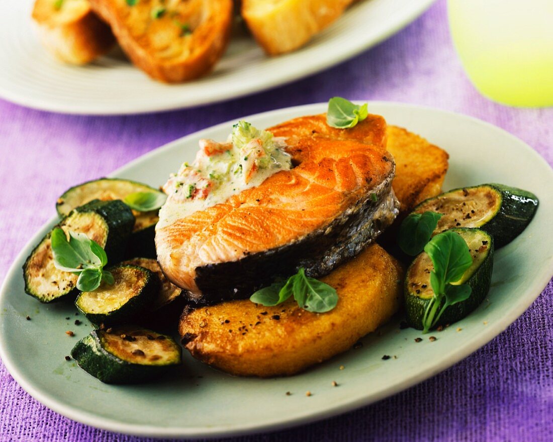Salmon steak with courgettes and a herb sauce