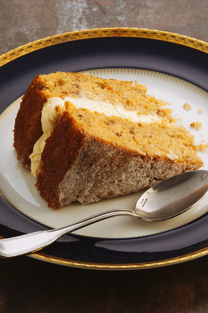A slice of parsnip cake with maple syrup
