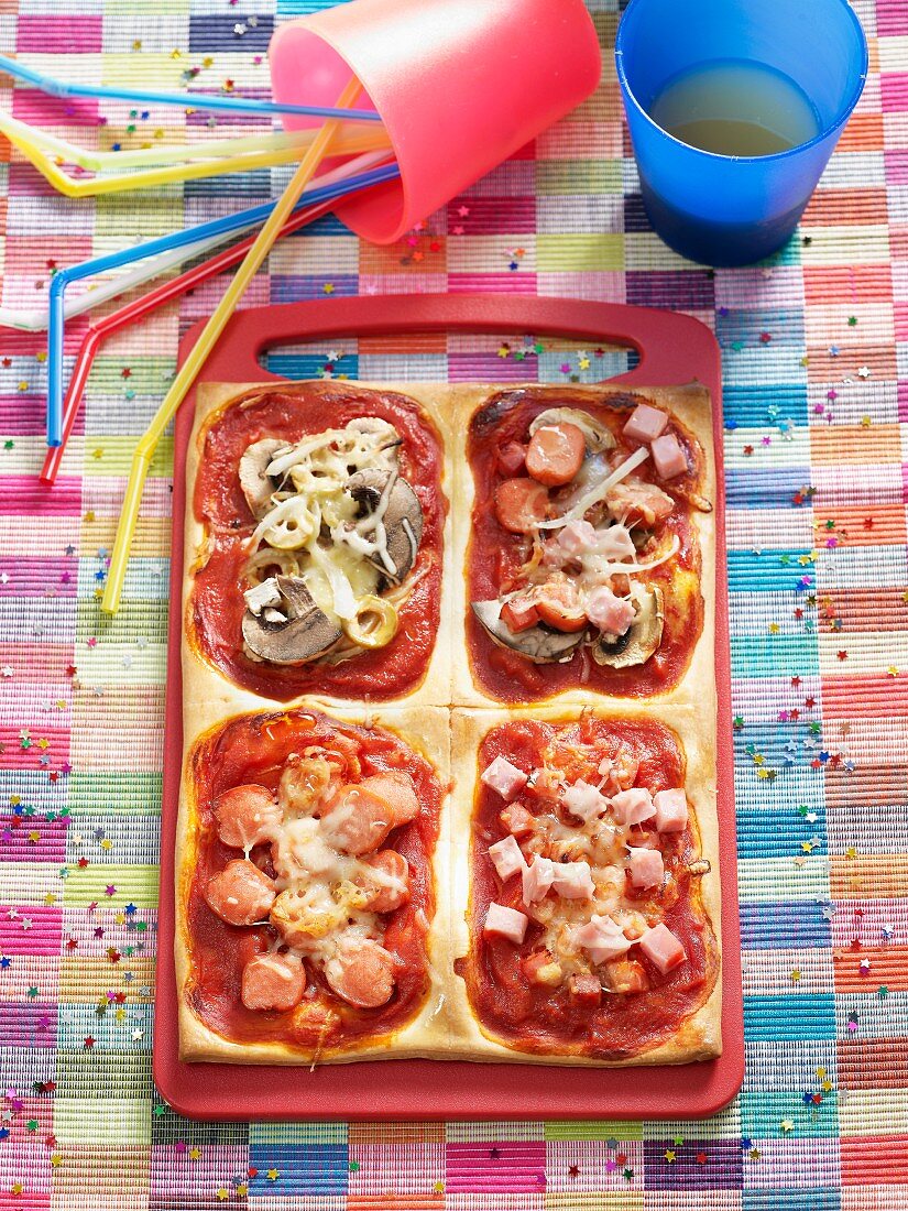 Rectangular child's pizza with a variety of toppings