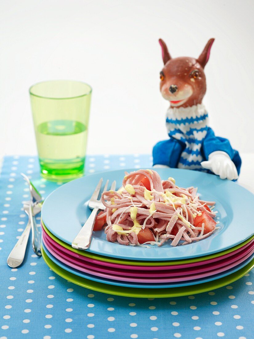 Tomato salad with strips of ham