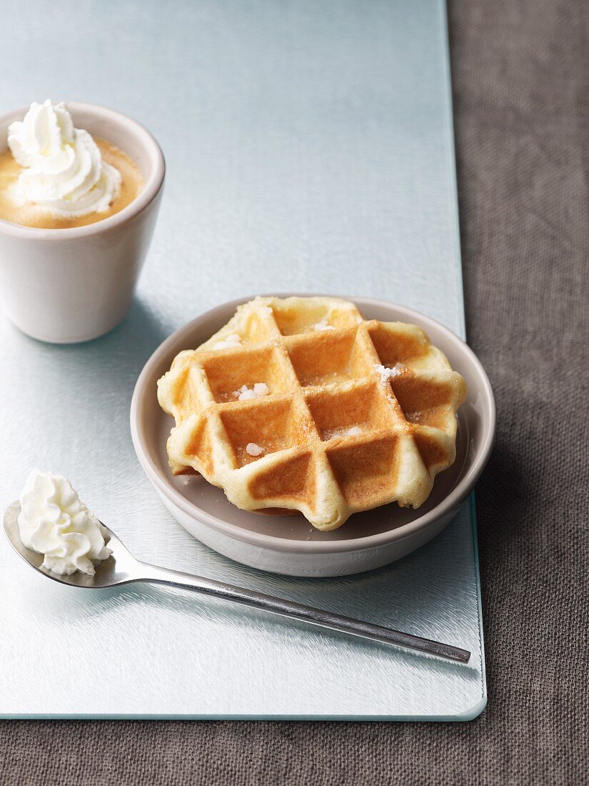 A waffle with coffee and cream