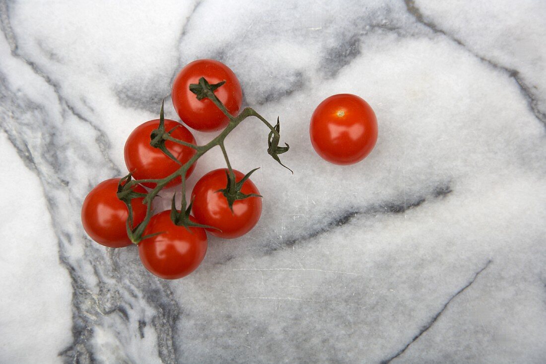 Cherry tomatoes on a marble slab