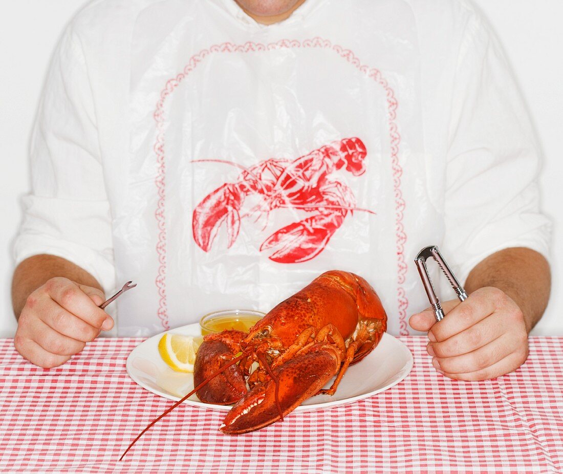 Man eating a lobster