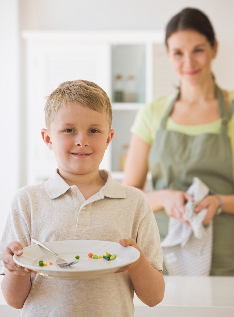 Boy holding dinner plate