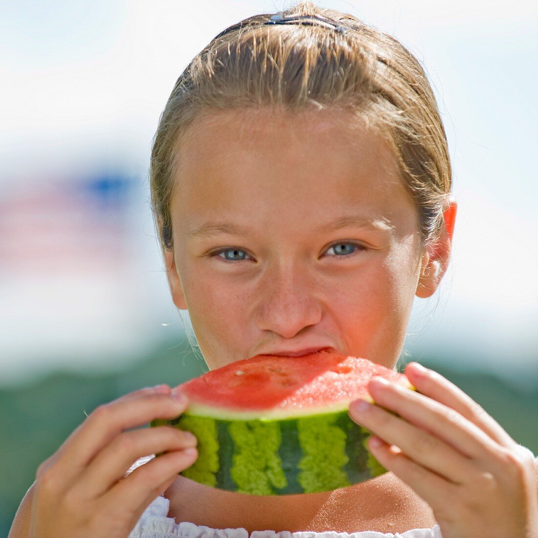 A girl eating a water melon