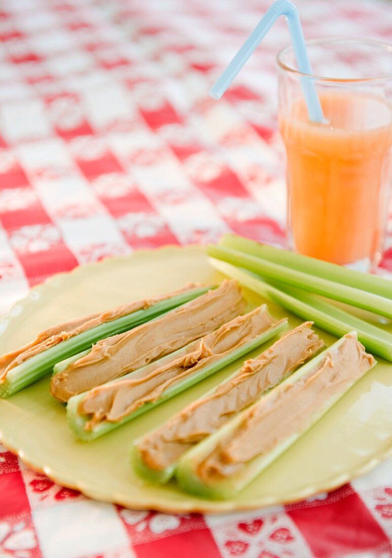 Celery and peanut butter on plate