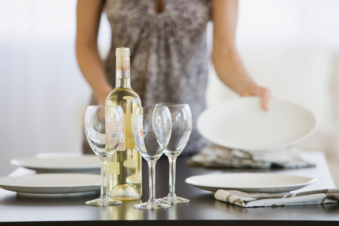 Woman setting table