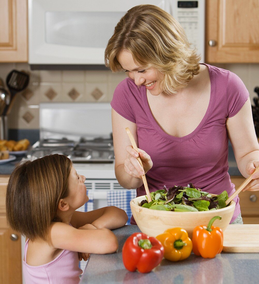 Mother and daughter smiling at each other