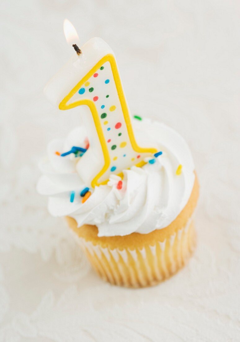 Still life of cupcake with one candle