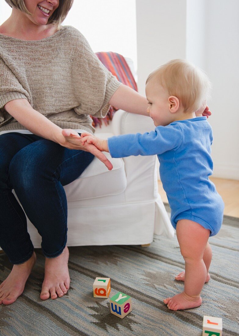 Mother with son (6-11 months) at home