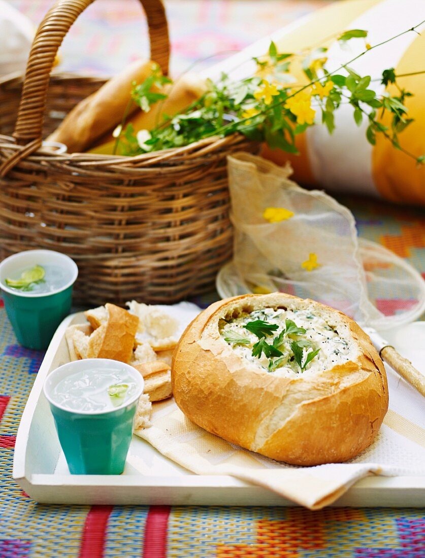 Bread filled with cream cheese and spinach dip, for a picnic for Australia Day