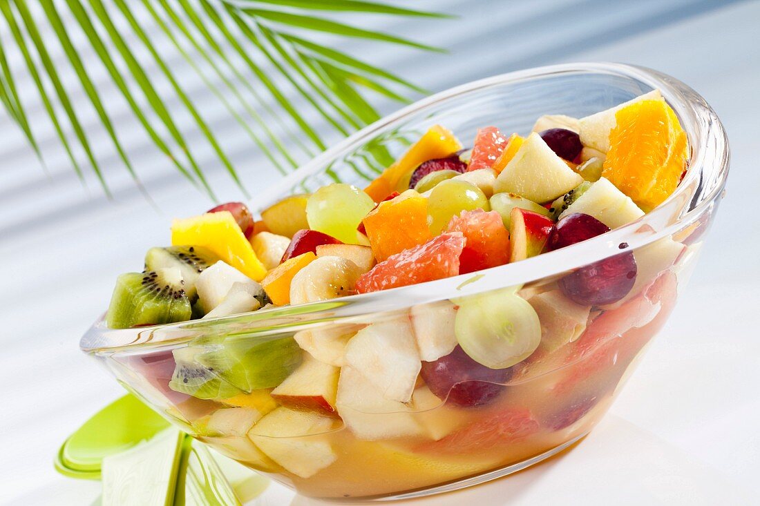 Mixed fruit salad with mango, pear, apple, kiwi, grapes, banana, oranges and grapefruit