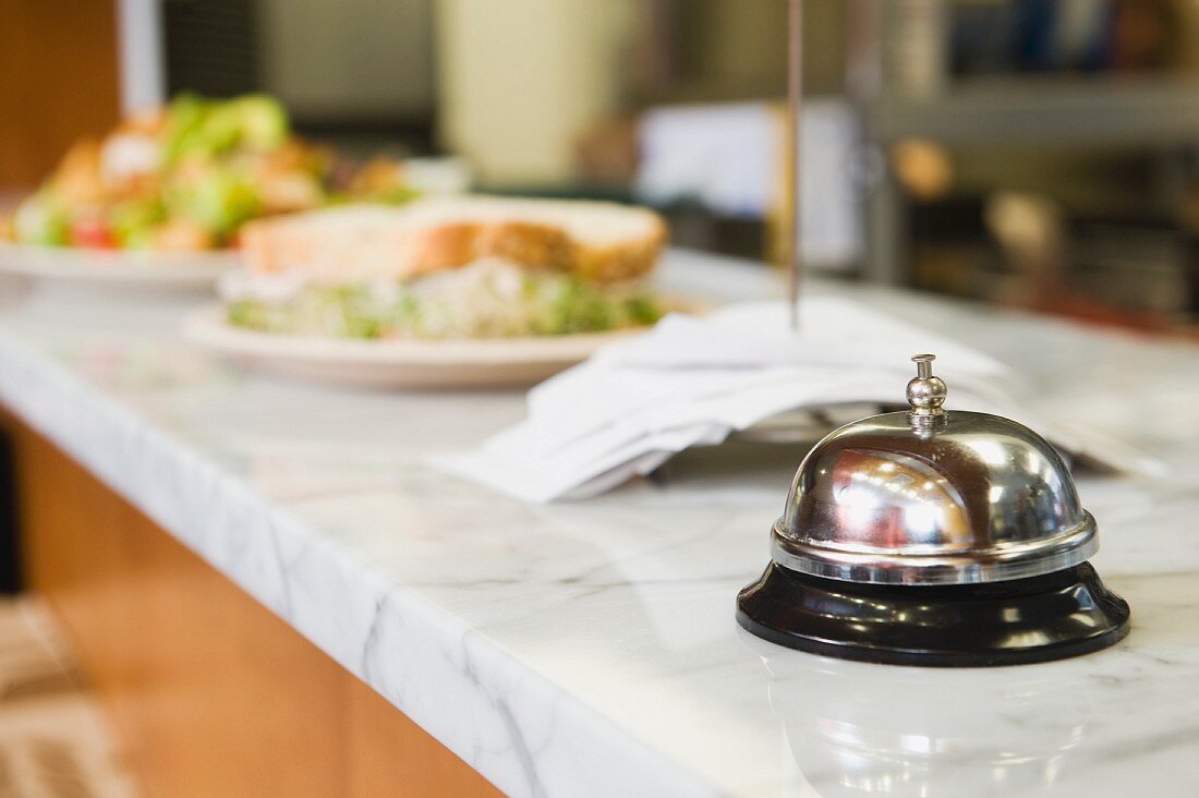 Bell on counter in restaurant