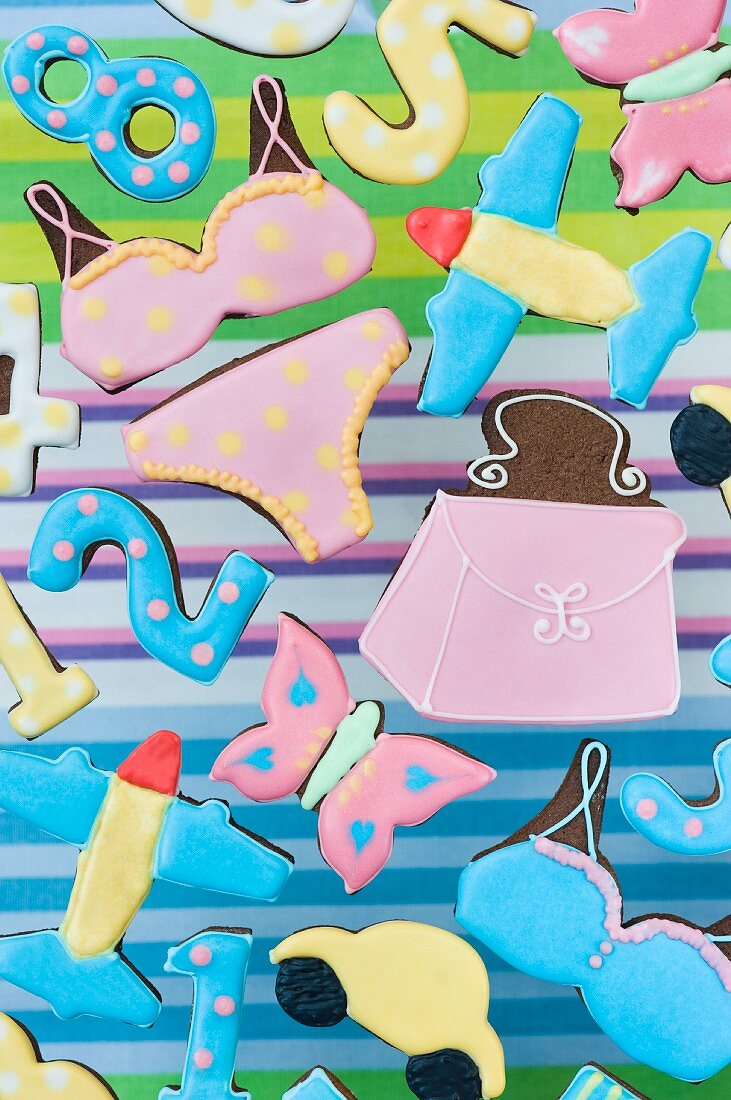 Cookies in various shapes (butterfly, bikini, handbag, airplane, numbers, car)