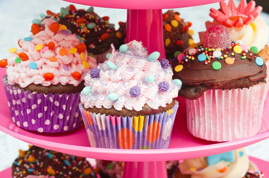 Colorful cupcakes for a party on a cake stand