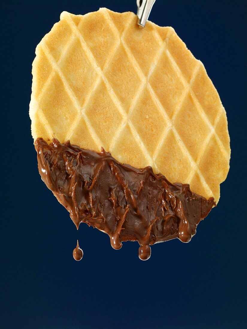 Waffled dipped in melted chocolate