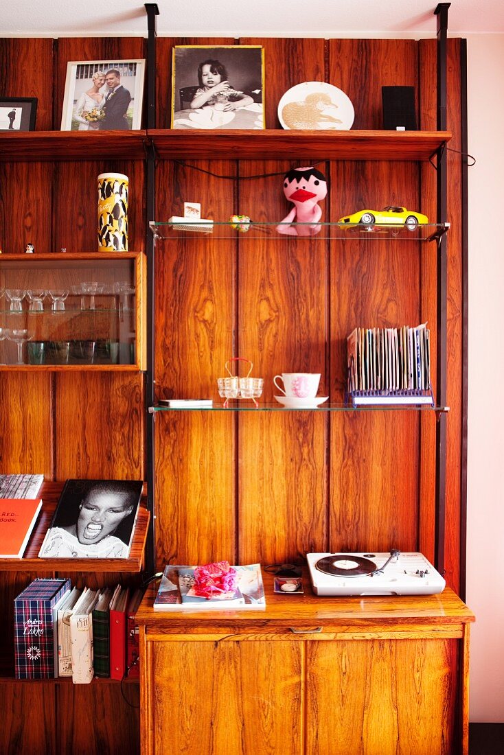 Various ornaments on wooden shelving unit