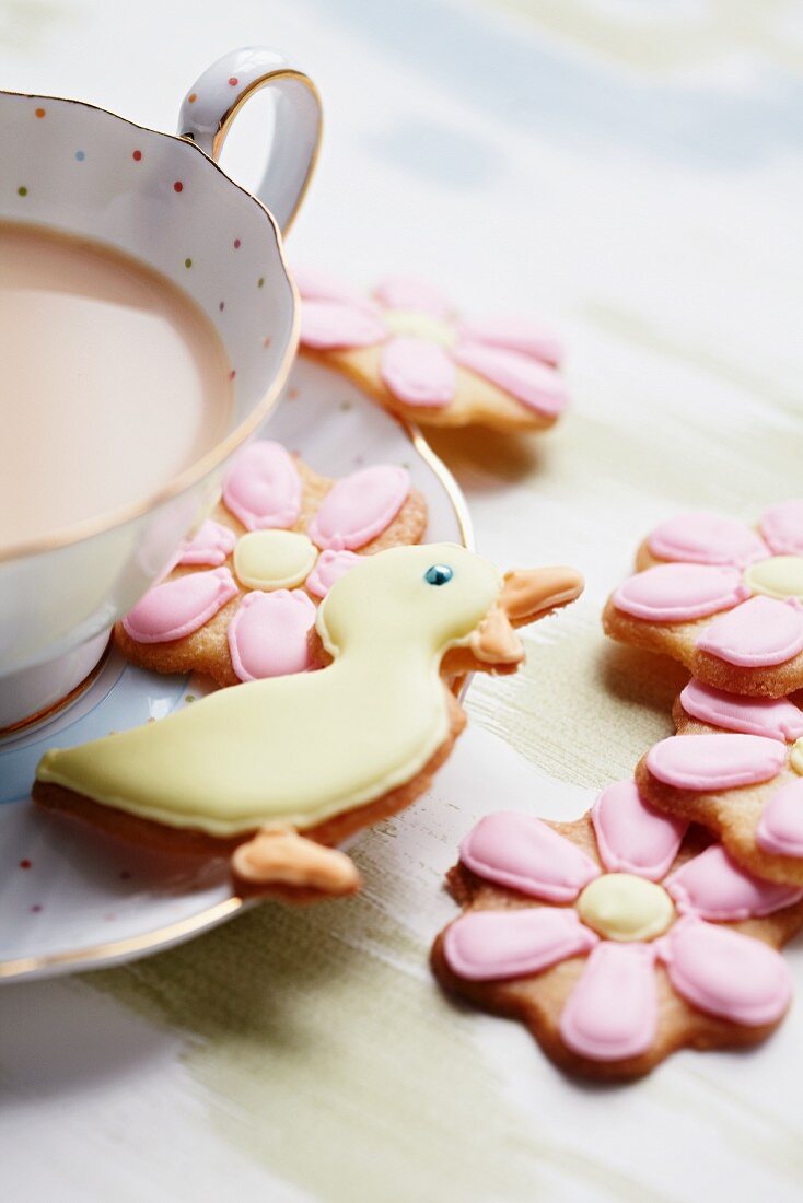Butter biscuits with icing, with a cup of tea
